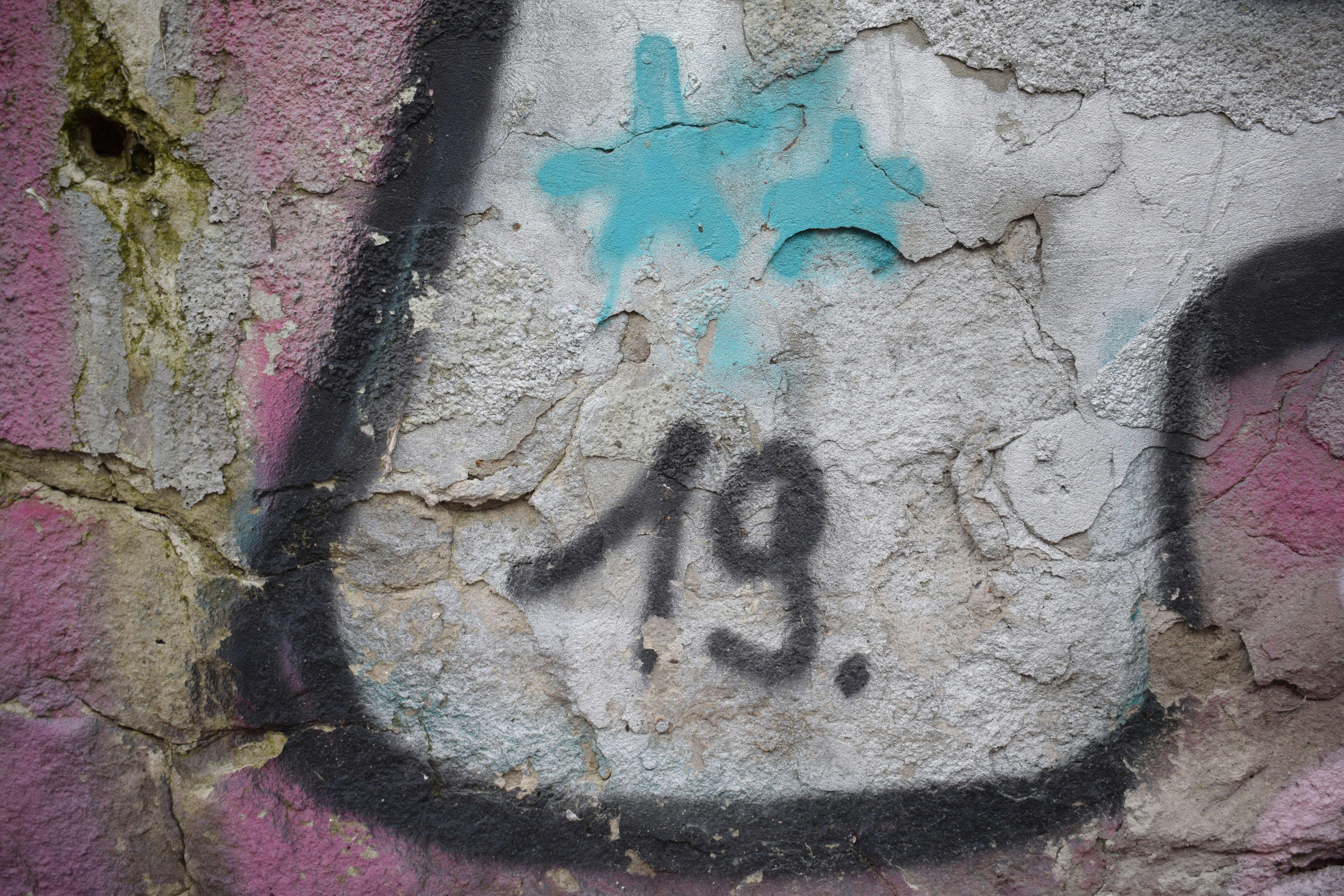 a wall with graffiti on it with the number 29 painted on it